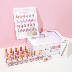 Framed Cre8tion Quiet Rose cat eye chart above rows of rose gold bottles and the kit box, on a pink set.