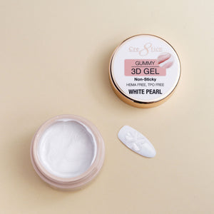 Open jar of Cre8tion Gummy 3D gel in White Pearl with a shaped bead of gel beside it.