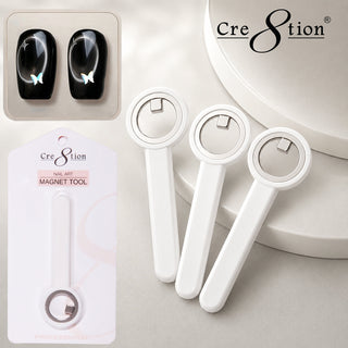 Three white circle cat eye magnets with handles beside a card of two black cat eye swatch nails.