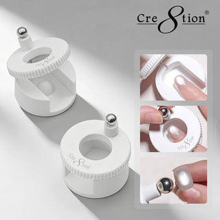 Two white Cre8tion rotating cat eye magnets with steel ball tips, with inset photos of use on a nail.