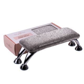 Silver glitter Cre8tion arm rest on chrome legs, shown beside its pink retail box.