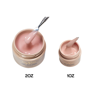 Cre8tion Morning Light builder gel in 2oz and 1oz gold jars, a spatula lifting soft nude gel.