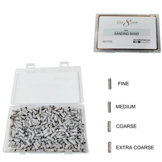 Clear box of 500 zebra striped Cre8tion mini sanding bands with a grit key from fine to extra coarse.