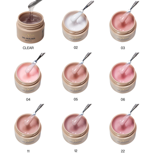 Nine open Cre8tion builder gel jars from clear through pink and mauve, each with a spatula of gel.