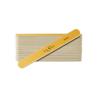 Stack of Cre8tion gold nail files with one regular straight 80/80 file laid across the top of the bundle.