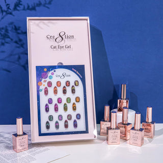 Cre8tion Orbit Spectrum cat eye chart in a pale box on deep blue, rose gold bottles fanned in front.