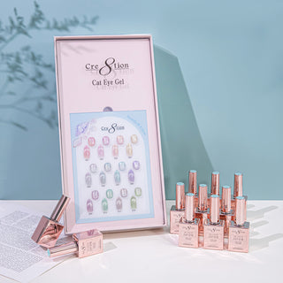 Framed Cre8tion Seashell Glow cat eye chart with pastel swatch nails and rose gold bottles, on a teal set.