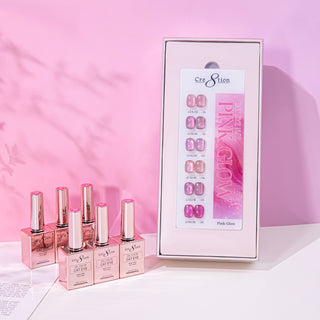 Cre8tion Pink Glow cat eye box open to six pink swatch nails, rose gold bottles on a pink set.