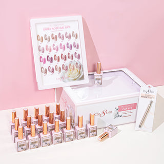 Framed Cre8tion Quiet Rose cat eye chart above rows of rose gold bottles and the kit box, on a pink set.