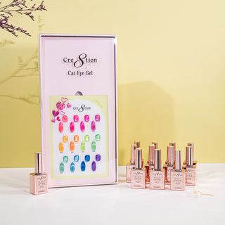 Framed Cre8tion Lollipops cat eye chart with bright swatch nails and rose gold bottles, on a yellow set.