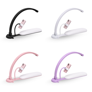 Four Cre8tion nail arch LED lights with padded arm rests in black, white, pink and purple.