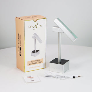 Cre8tion 2 in 1 silver desk lamp on a square base beside its kraft retail box and charging cable.