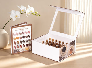 Tea & Coffee Cat Eye kit and color booklet on a sunlit table