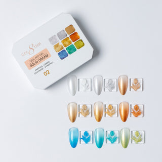 Cre8tion Solid Cream art gel palette 02 Metallic, nine colors with swatch nails in gold, copper and blue.