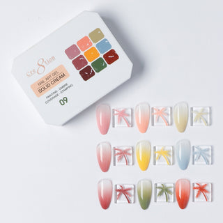 Cre8tion Solid Cream art gel palette 09, nine colors with palm tree and starburst art on swatch nails.
