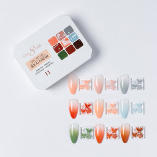 Cre8tion Solid Cream art gel palette 11, nine colors with orange, green and blue swatch nails.