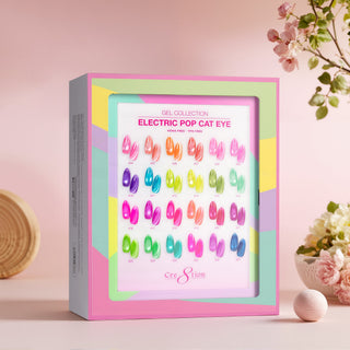 Cre8tion Electric Pop cat eye kit box showing 24 bright swatch tips, styled on pink with blossoms.
