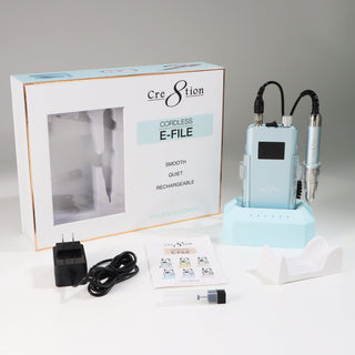 Sky Blue Cre8tion Cordless E-File with its box, charging dock, adapter, manual and handpiece rest