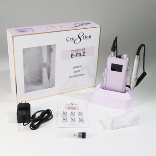 Soft Violet Cre8tion Cordless E-File with its box, charging dock, adapter, manual and handpiece rest