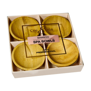 Four round bamboo spa bowls seated in a kraft gift box with a printed Cre8tion band.